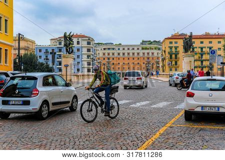 Verona, Italy - July,  , 2019: traffic on a strett of  Verona , Italy