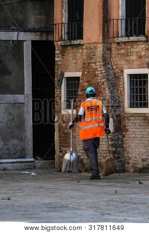 Venice, Italy - July, 11, 2019: Yard-keeper in Venice, Italy