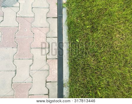 Separated Background With Paving Stones And Grass