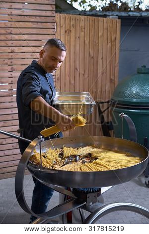 Preparetion Dish Of Spaghetti With Clams In A Restaurant Kitchen