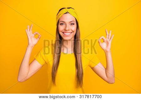 Portrait Of Lovely Millennial Showing Double Okay Sign With Beaming Amile Isolated Over Yellow Backg