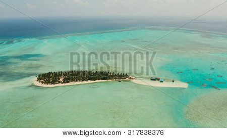 Tropical Island Among Coral Reefs With A White Beach And Blue Atoll Water. Onok Island, Balabac, Phi