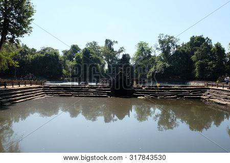 Ancient Pool. The Pool, The Shore And The Bottom Of Which Are Laid Out Of Stone Blocks. Neak Pean. K