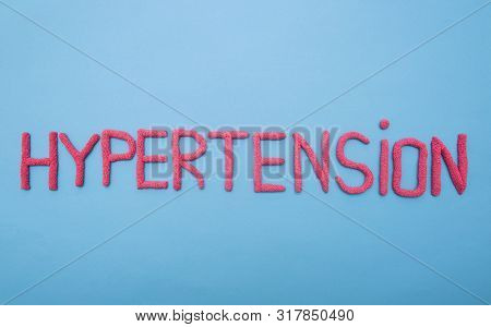 Inscription Hypertension On A Blue Background Concept Of Medicine And Hypertension, Increased Blood 