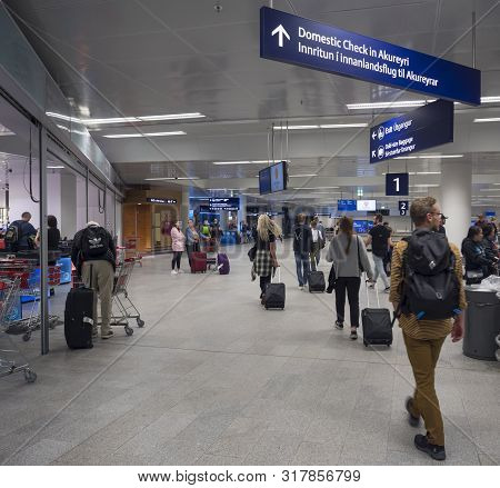 Iceland, Keflavik, July 30, 2019: Tourist People Visiting Iceland Leaving Keflavik Airport