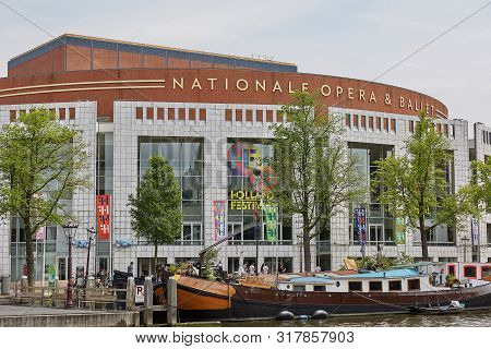 Tourist Boat In Front Of The Nationale Opera & Ballet In Amsterdam Netherlands