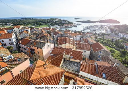 Vrsar, Croatia - May 20, 2018: View On Old Red Roofs Of Small Croatian Town Vrsar, Yachts And The Me