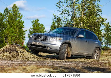 Novyy Urengoy, Russia - August 11, 2019: Grey Crossover Infiniti Fx35 At The Countryside.