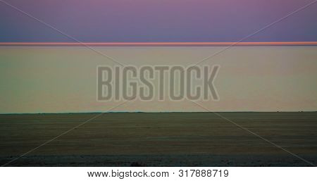 Panorama View To Aral Sea From The Rim Of Plateau Ustyurt Near Aktumsuk Cape At Sunset In Karakalpak