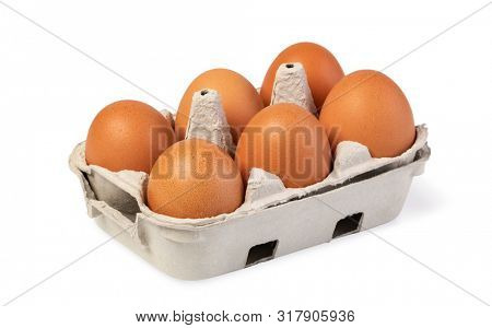 Dozen eggs in a cardboard box; Isolated on white background; brown; isolated