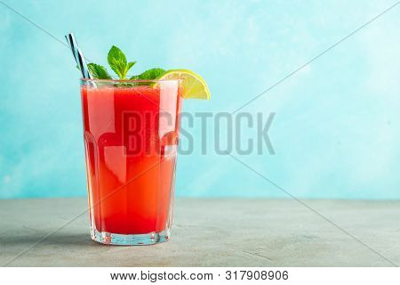Watermelon Slushie With Lime And Mint, Summer Refreshing Drink In Tall Glasses On A Light Blue Backg