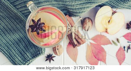 Autumn Mulled Wine Or Gluhwein Based On White Wine With Rum, Apple And Spices Cinnamon Sticks, Star 