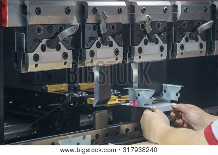 The Hydraulic Bending Machine Operation By Technical Operator. The Sheet Metal Manufacturing Process