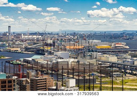 Aerial view kobe cityscape and Port industrial zone in Kobe Hyogo Kansai Japan using for import export shipping and global business background 