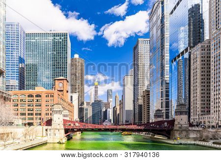 Chicago Skylines building along green dyeing river of Chicago River on St. Patrick day festival in Chicago Downtown IL USA