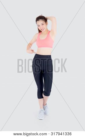 Beautiful Portrait Young Asian Woman In Sport Clothing Pointing Waist With Satisfied And Confident I