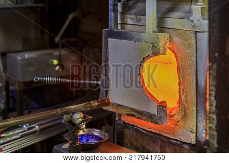 Glass Blowing Furnace And Table With Various Glass Blowing Tools At A Glass Makers Workshop Set Up F