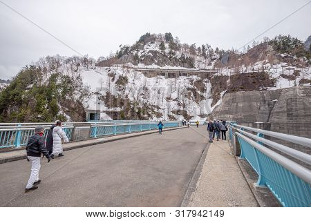 Toyama, Japan - April 21, 2019 : Unidentified Tourists Walking At  Kurobe Dam On Tateyama Kurobe Alp