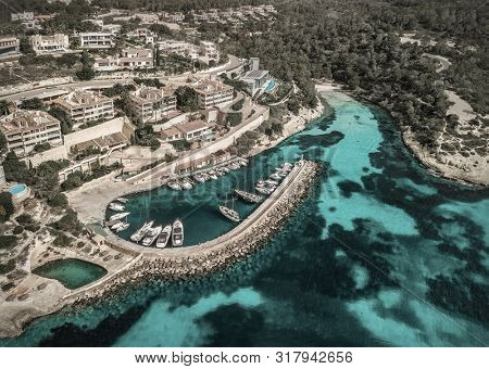 Beautiful birdeye view on the sea coastline with pier and yakhts at sunny day. Travell, jorney,islands, Seascape, freedom, holidays concept.