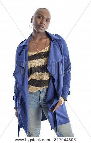 Black African American Fashion Model With Bald Hairstyle Confidently Posing With A Vibrant Blue Colo