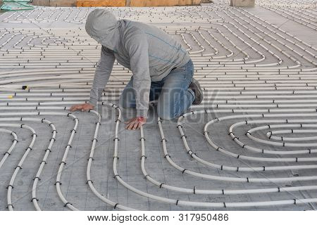 Burgas, Bulgaria - March 02, 2019: Hvac Technician Working On Underfloor Heating System Installation
