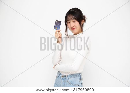 Young Beautiful Asian Woman Smiling, Showing, Presenting Credit Card For Making Payment Or Paying On