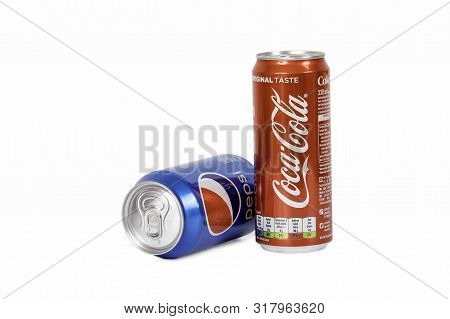 Riga, Latvia - August 19 ,2019 : 330ml Coca Cola And Pepsi Isolated On White Background