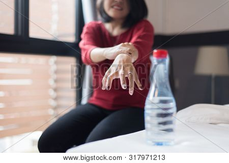 Woman Suffering With Parkinson Disease Symptoms,selective Focus