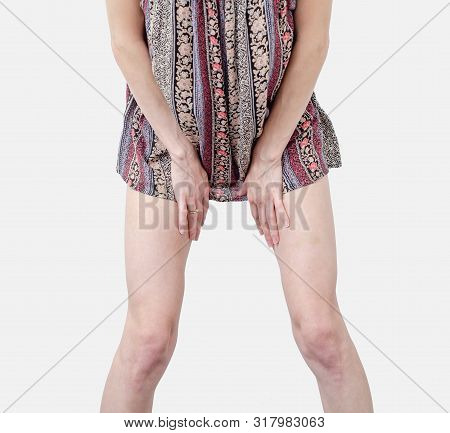 Young Woman In A Dress, Body, Legs, Stands In A Sexy Pose, Spreading Legs Isolated On White Backgrou