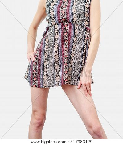 Young Woman In A Dress, Body, Legs, Stands In A Sexy Pose, Spreading Legs Isolated On White Backgrou