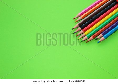 Drawings With Colored Pencils On A Green Background.many Colors.