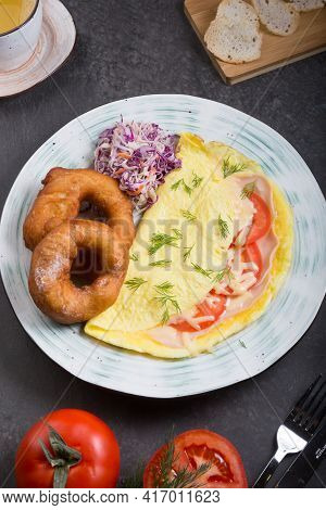 Donuts And Egg Served For Breakfast On A Table