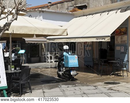 Limassol, Cyprus, April 14th, 2021: Wolt Delivery Man On Motorbike In The Old Town