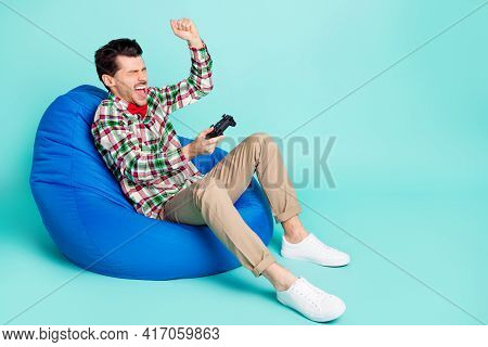 Profile Photo Of Guy Sit Bag Hold Gamepad Raise Fist Wear Plaid Shirt Tie Pants Shoes Isolated Blue 