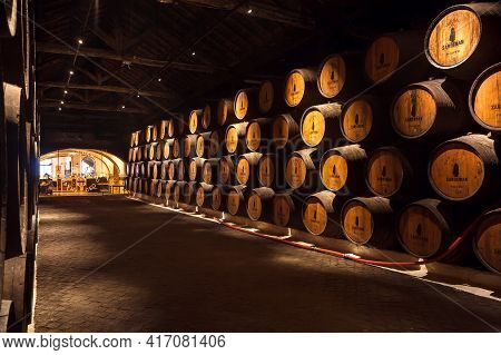 Porto, Portugal: Historical Corridor Inside Winery Sandeman, With Wooden Barrel, It Making Porto Win