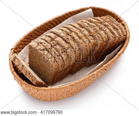 sliced rye bread in a wicker basket, isolated on a white background