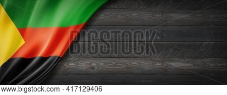 Azawad Mnla Flag On Black Wood Wall. Horizontal Panoramic Banner.