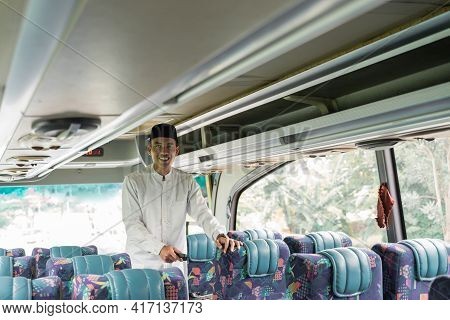 Asian Muslim Man Doing Eid Mubarak Traveling Back To His Hometown By Riding A Bus
