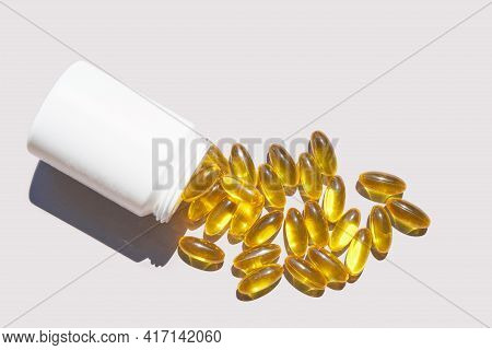 Omega3 Gel Capsule. Sun Shadow. Yellow Vitamin. Health Eating. Dietology Drug. Fish Oil Supplement. 