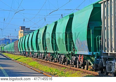 Green cargo bunker wagon line on railways and blue sky in sunny day