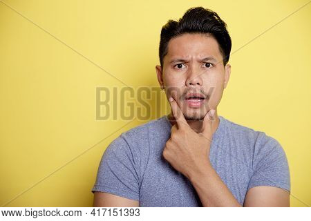 Casual Young Man Smile Thinking Idea With Holding The Chin