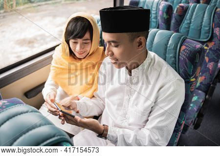 Muslim Couple Travel By Bus During Eid Mubarak Holiday