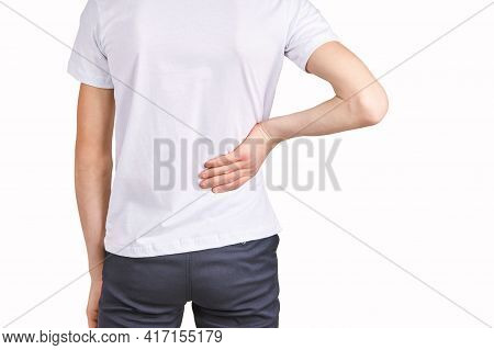 Children Portrait In White T-shirt. Studio Isolated Concept. Lower Back Problem. Health Care. Bad Em