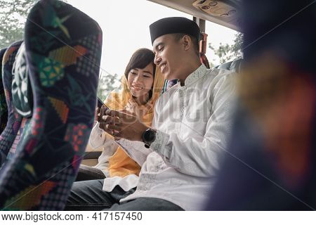 Muslim Couple Travel By Bus During Eid Mubarak Holiday
