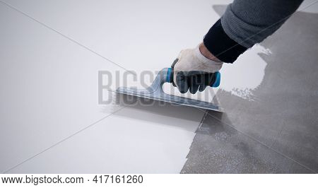 Worker Works With Epoxy Resin For Interiors