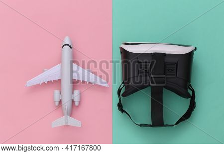 Virtual Travel. Virtual Reality Headset With Plane On Pink Blue Background. Top View