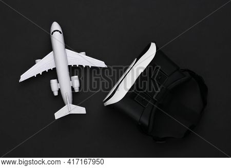 Virtual Travel. Virtual Reality Headset With Plane On Black Background. Top View