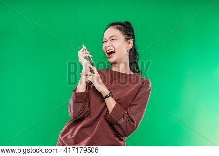 Portrait Beautiful Woman Is Talking On The Phone With Someone, Expression Laugh Happily
