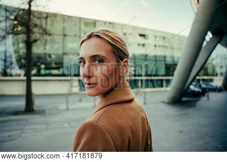 Beautiful Caucasian Business Woman With Blue Eyes Walking To Work