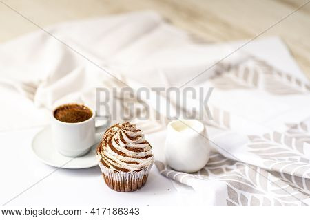 Black Coffee With Cupcakes And Muffins. Spice Cupcakes With Creamcheese Frosting Decorated With A Co